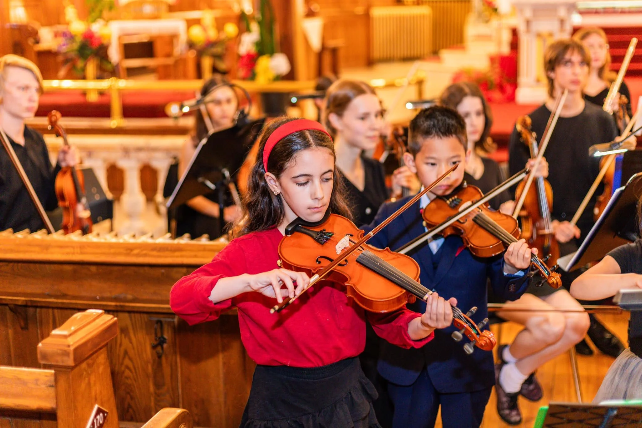 OSJVS Junior Orchestra playing violin