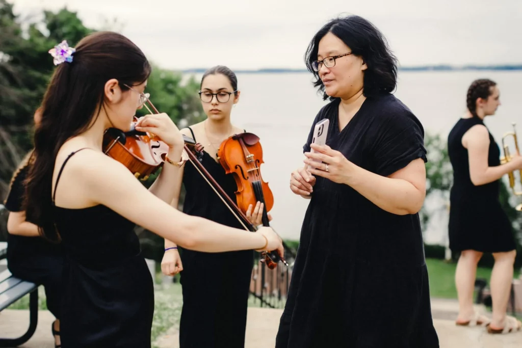OSJVS Orchestra Artistic Director (Judy Hung) Guiding Musicians
